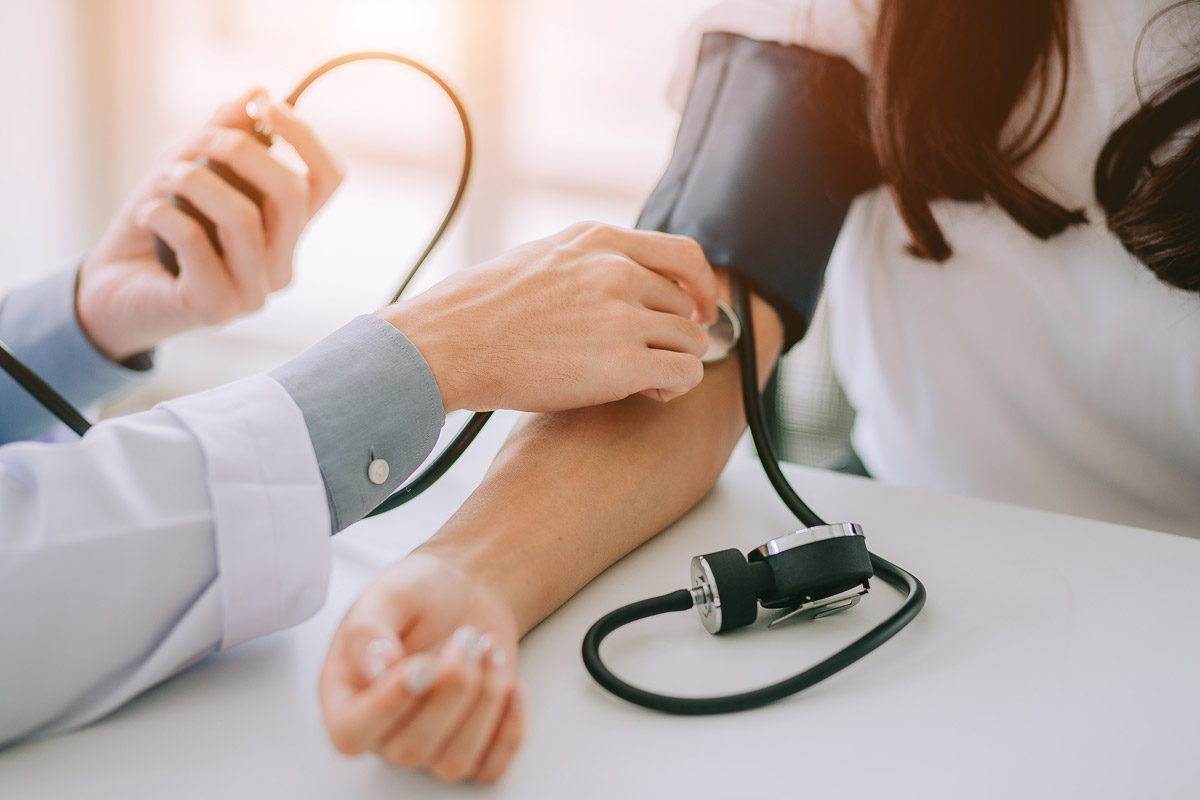 close-up of patient's blood pressure being taken